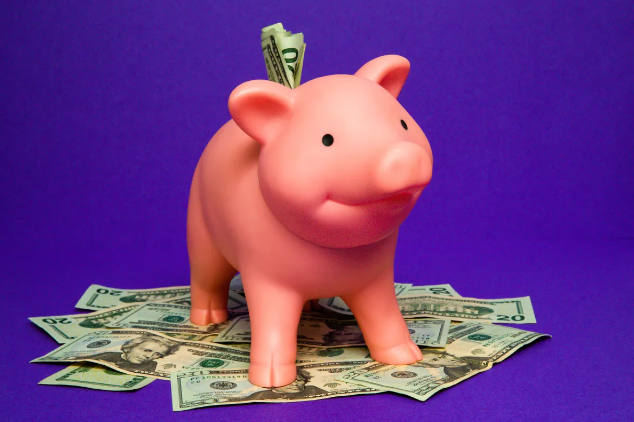 This is an image of a piggy bank overflowing with $20 bills. The point of the image is to show how much a customer could save by hiring Seth Mason for his content writing, copywriting, and marketing strategy services.