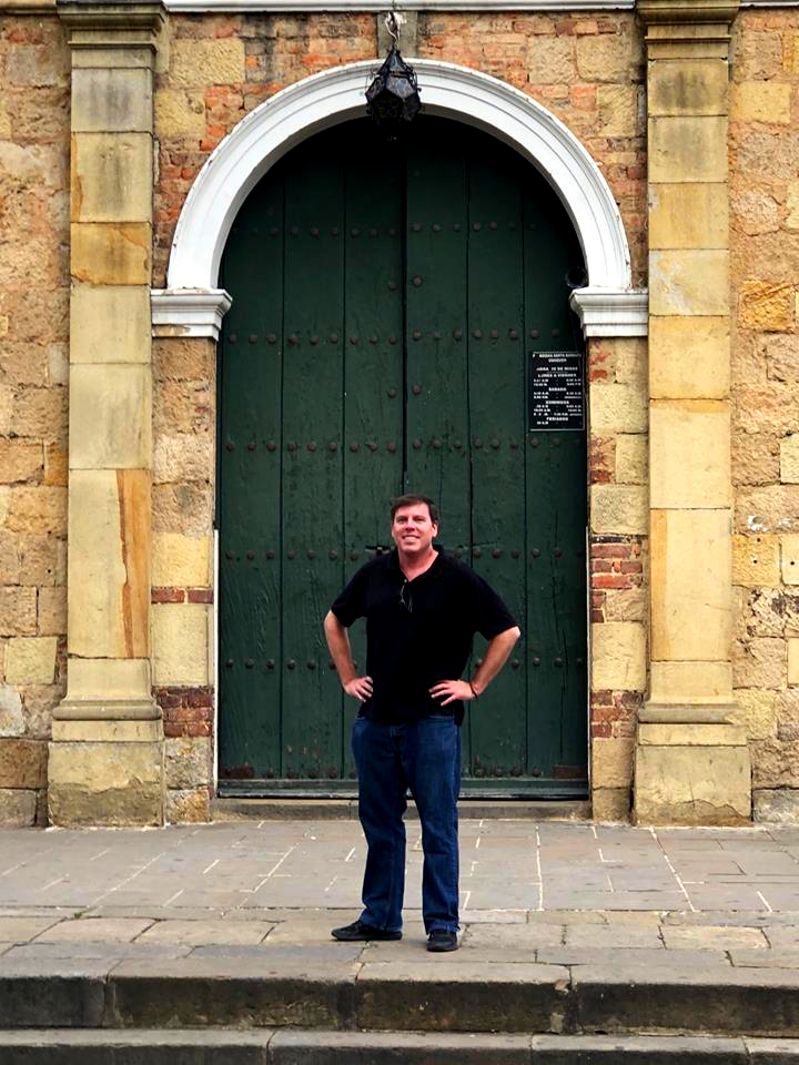 This is photo of Content Writing & Copywriting's Seth Mason standing in front of a centuries-old cathedral. 