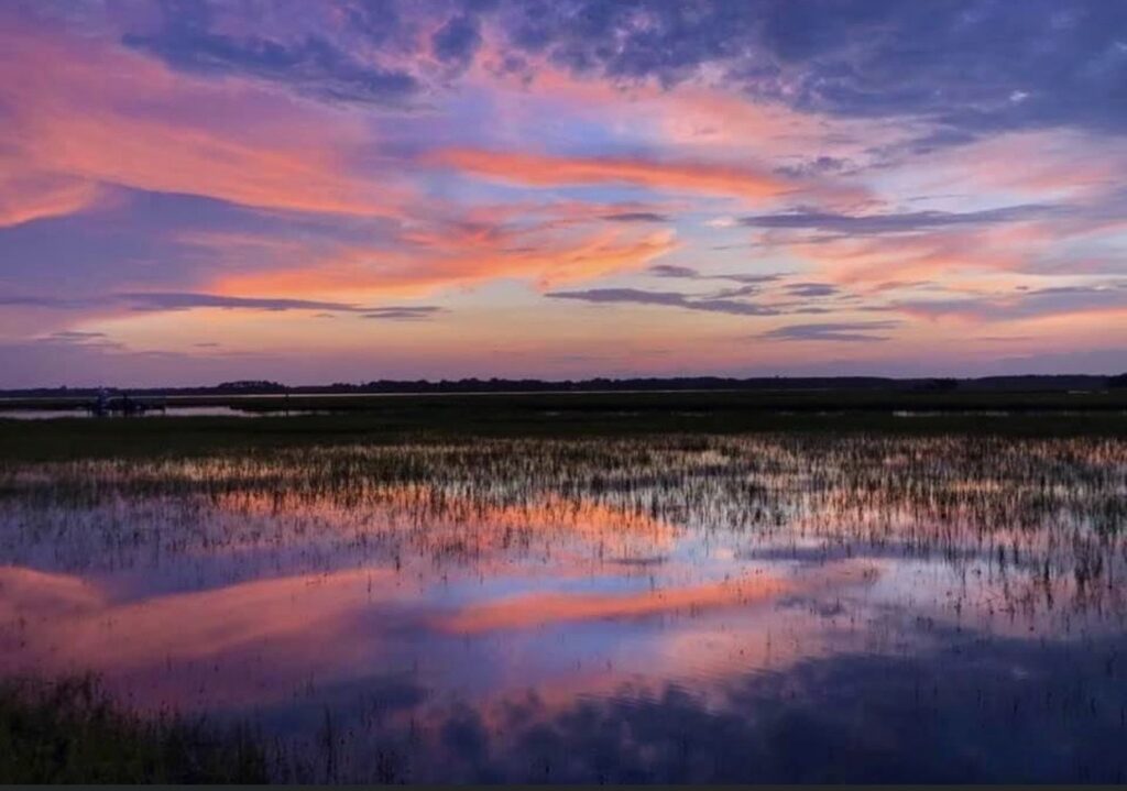 This is a reflection of a multi-colored sunset over salt marsh typical of the South Carolina Lowcountry.