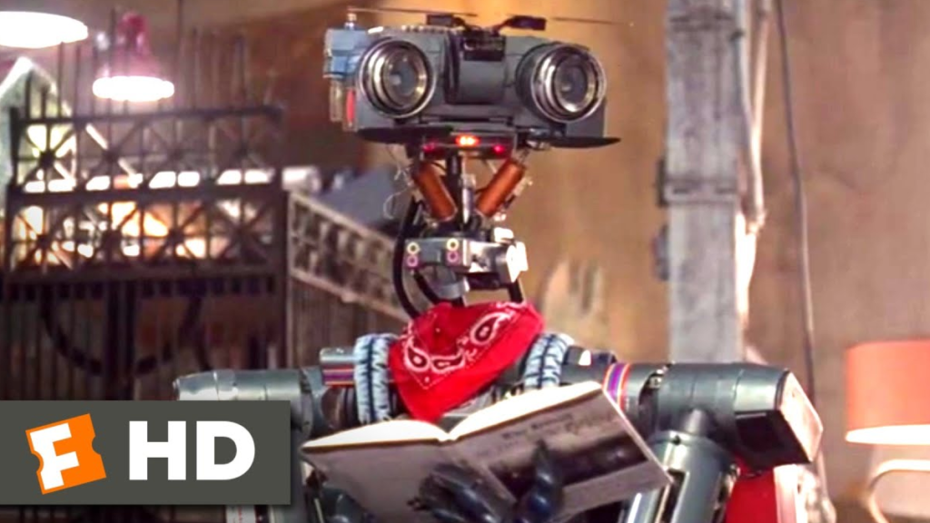 Johnny 5, the "lovable" caricature of artificial intelligence from the Short Circuit franchise, is sometimes used as a pejorative term for generative A.I. While this author believes that generative A.I. has the potential to benefit the world in numerous ways, he also recognizes that it has the potential of debasing the value of artistry. Credit: Sony
